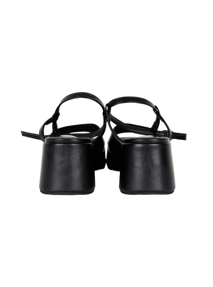 Plaid Slingback Platform Heels CL523 Black flat pair shot from back angle, showing block heel construction, slingback ankle straps, and smooth black leather finish