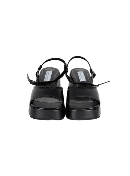Plaid Slingback Platform Heels CL523 Black flat pair shot from front angle, showing solid black leather upper, open toe strap, ankle buckle, and chunky platform