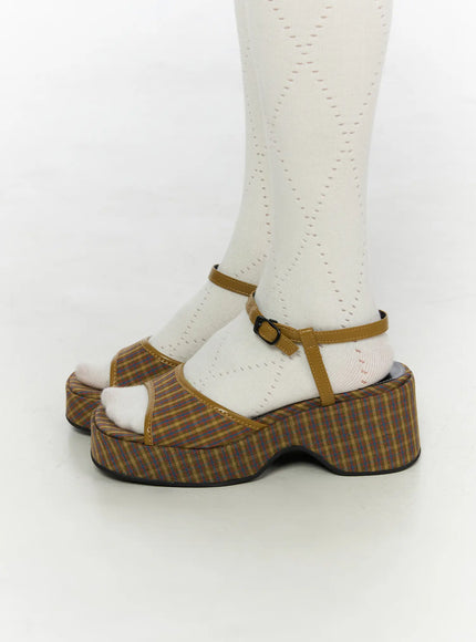 Plaid Slingback Platform Heels CL523 Brown close-up side view on model in white tights, showcasing ankle strap, block heel height, and curved platform silhouette