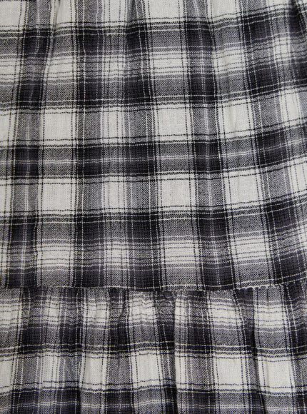 Plaid Tiered Midi Skirt CU529 close-up fabric detail showing woven black and white plaid texture with visible weave structure and gathered ruffle