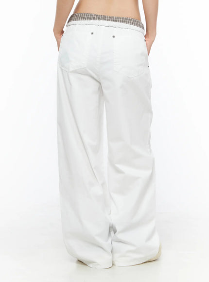 Plaid Waistband Wide-Leg Trousers CL502 White back model shot revealing plaid waistband back pockets and silver rivet hardware on wide-leg trousers