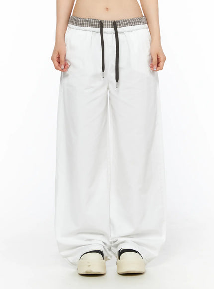 Plaid Waistband Wide-Leg Trousers CL502 White front close-up model shot showing plaid elastic waistband dark drawstring and wide-leg silhouette