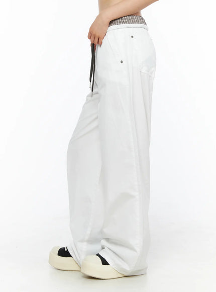 Plaid Waistband Wide-Leg Trousers CL502 White side model shot displaying drawstring detail side snap button pocket and relaxed wide-leg drape