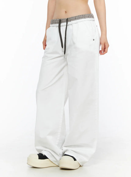 Plaid Waistband Wide-Leg Trousers CL502 White three-quarter side model crop shot highlighting plaid waistband drawstring and relaxed wide-leg trouser leg