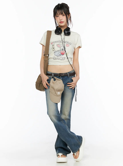 Playful Print Cropped T-Shirt CU530 cream full-body front shot on model styled with low-rise jeans belt and baseball cap
