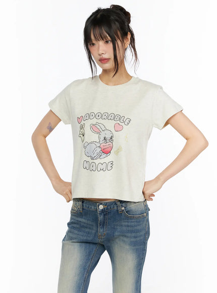 Playful Print Cropped T-Shirt CU530 cream close-up front shot on model showing adorable bunny Social Anxiety graphic print detail