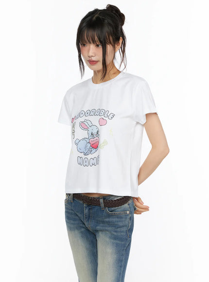 Playful Print Cropped T-Shirt CU530 white three-quarter front shot on model showing bunny print cropped fit styled with low-rise jeans