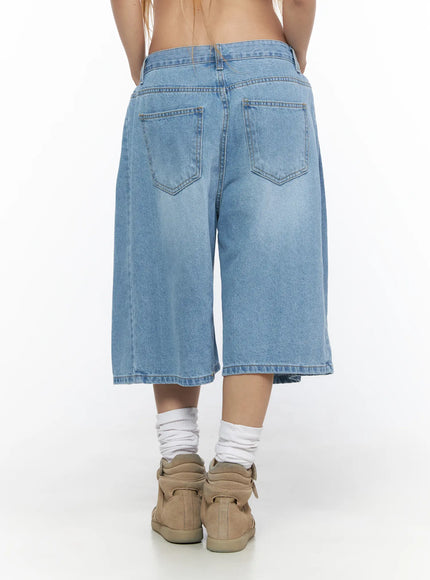 Pleated Denim Jorts CL528 light blue back shot on model showing dual back pockets stitching detail and wide-leg hem with sneakers