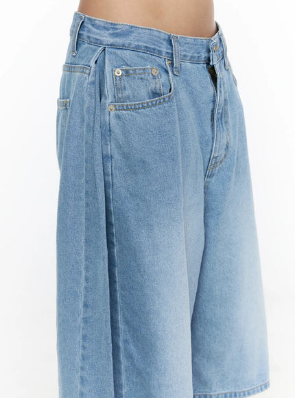 Pleated Denim Jorts CL528 light blue side detail close-up on model highlighting pleated waistband side pocket and wide-leg silhouette