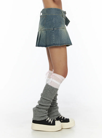 Pleated Denim Skirt CL503 Blue side shot on model revealing back pocket detail and pleated skirt panel with platform sneakers