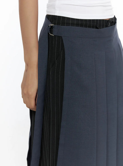 Pleated Midi Wrap Skirt CL513 navy blue close-up detail shot showing wrap panel D-ring fastening contrast black pinstripe inner layer and tailored pleat construction at hip