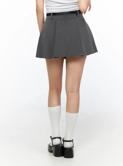 Pleated Mini Skirt CL517 Gray back shot on model showing smooth pleated rear panel, black belt, white knee socks and black Mary Jane platform heels