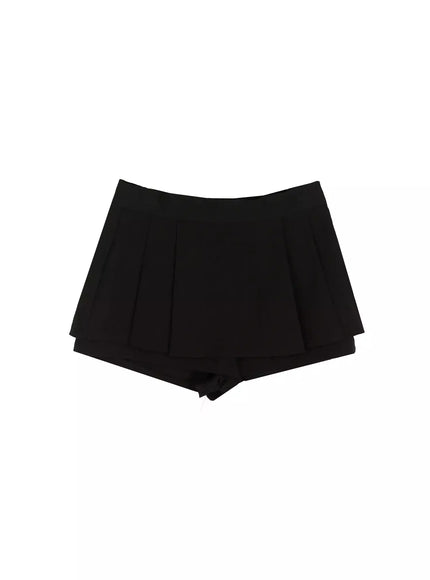 Pleated Skort IL515 Black flat-lay front view showing pleated skirt overlay with layered inner shorts and structured high waistband on white background
