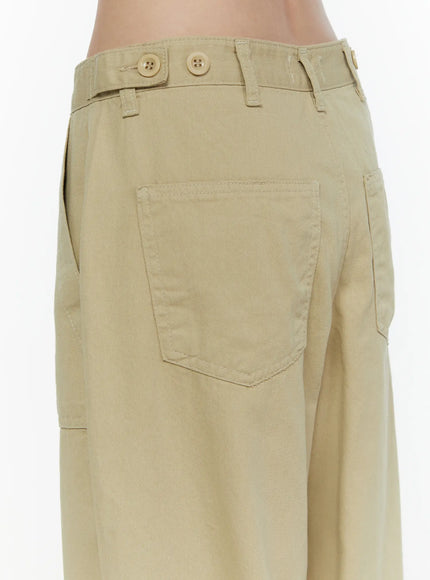 Pocket Detail Wide Leg Pants CL521 Beige close-up back detail showing rear patch pocket, adjustable waist tabs, and button closures on cotton twill fabric