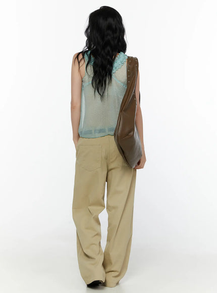 Pocket Detail Wide Leg Pants CL521 Beige full back styled shot on model carrying brown studded bag, wide-leg cotton trousers with back patch pockets