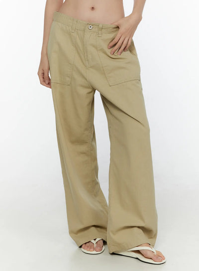 LEWKIN Pocket Detail Wide Leg Pants CL521 Beige size S front three-quarter shot on model wearing flip-flops, hand on hip, wide-leg cotton twill silhouette