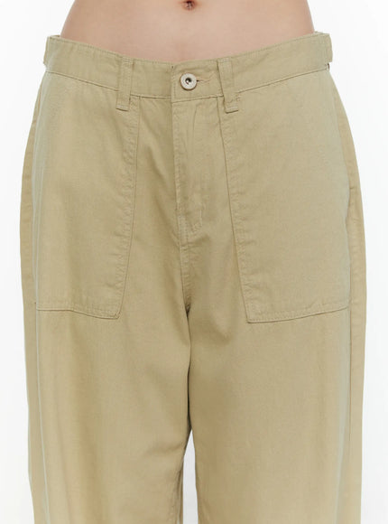 Pocket Detail Wide Leg Pants CL521 Beige close-up front detail on model showing waistband, single button closure, and large patch pockets