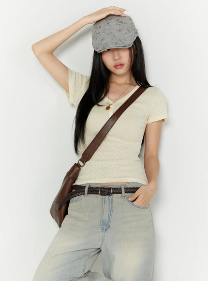 LEWKIN Pointelle Slim Henley V-Neck Tee IU524 Light beige S/M styled shot model wearing cap crossbody bag hand on hat leaning against wall