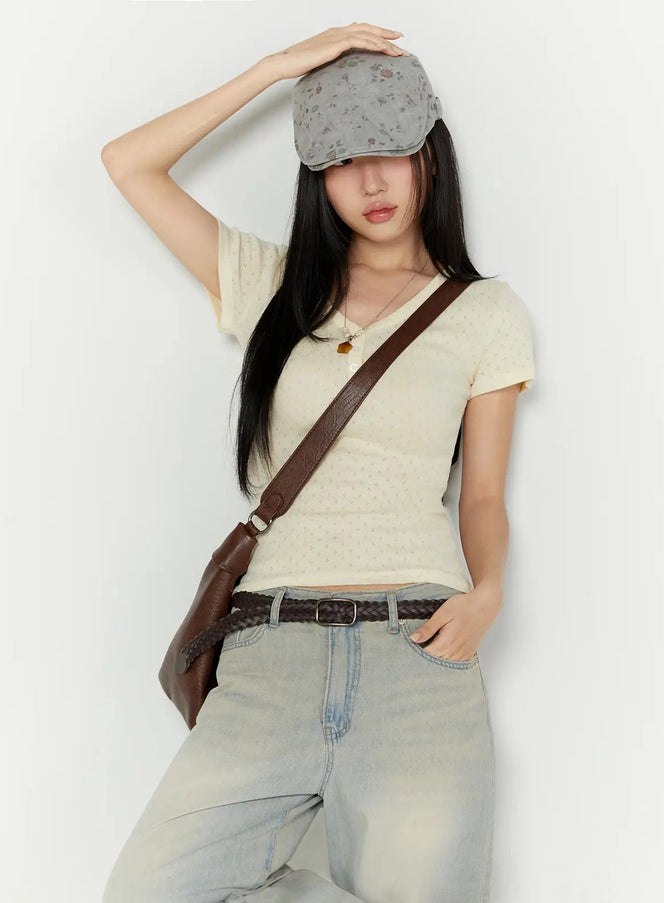 LEWKIN Pointelle Slim Henley V-Neck Tee IU524 Light beige S/M styled shot model wearing cap crossbody bag hand on hat leaning against wall