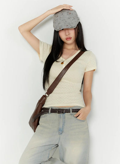 LEWKIN Pointelle Slim Henley V-Neck Tee IU524 Light beige S/M styled shot model wearing cap crossbody bag hand on hat leaning against wall