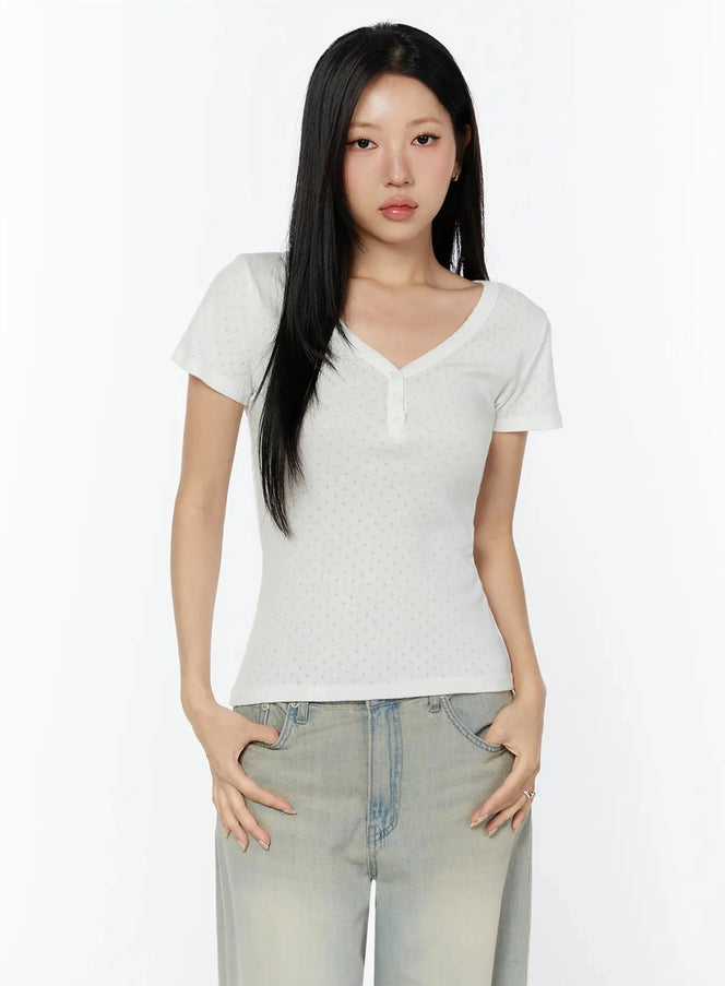 Pointelle Slim Henley V-Neck Tee IU524 white front shot model wearing fitted pointelle knit henley V-neck tee with button detail styled with jeans