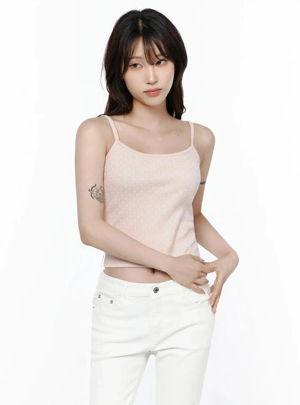 Polka Dot Cami Tank Top IL506 Pink upper-body front shot on model looking forward, arms crossed at waist, showing crop length and polka dot texture