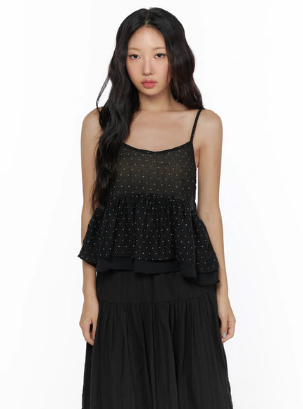 Polka Dot Frill Sleeveless Top CL510 Black close-up front shot on model showing sheer polka dot fabric, tiered ruffle hem, and thin spaghetti straps