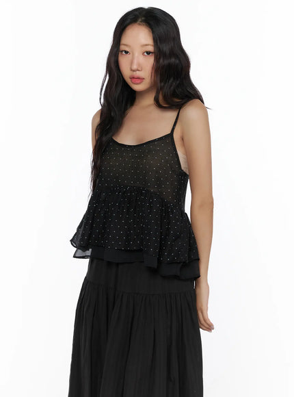 Polka Dot Frill Sleeveless Top CL510 Black three-quarter front shot on model without accessories showing layered ruffle hem and sheer spaghetti-strap silhouette