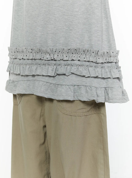 Polka Dot Frill Tee CL507 Gray detail close-up shot showing three-tier ruffle hem with polka dot frill layer worn over khaki wide-leg trousers