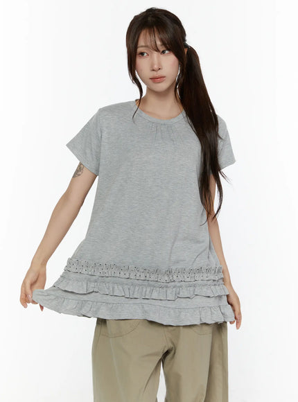 Polka Dot Frill Tee CL507 Gray front close-up shot model holding hem to display three-tier ruffle detail with polka dot top frill and cotton jersey fabric
