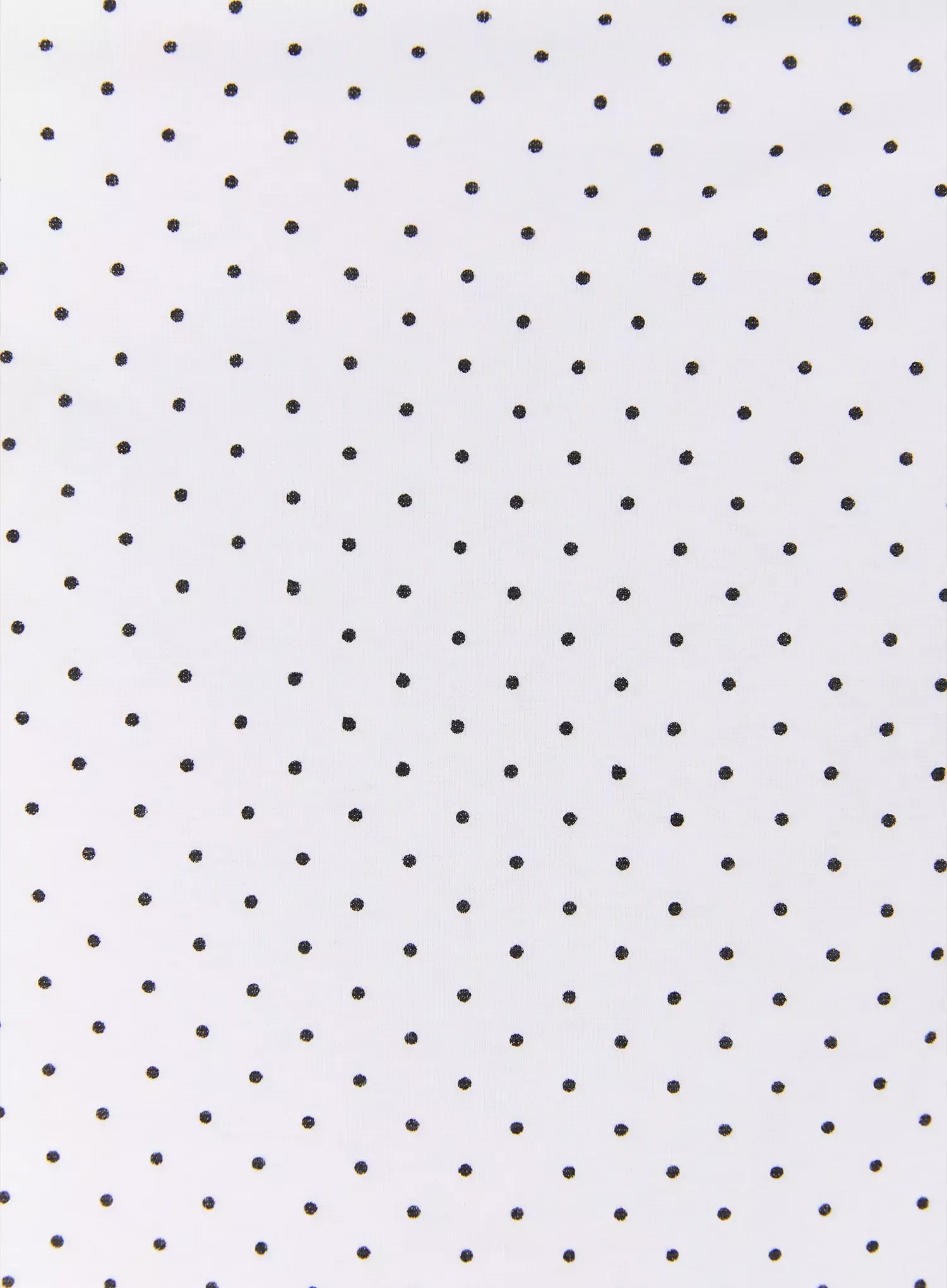 Polka Dot Halter Top IL502 White fabric close-up showing white base with evenly scattered small black polka dot knit texture