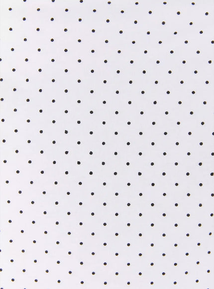 Polka Dot Halter Top IL502 White fabric close-up showing white base with evenly scattered small black polka dot knit texture