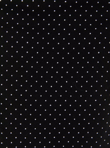 Polka Dot Halter Top IL502 Black fabric close-up showing black base with evenly scattered small white polka dot knit texture