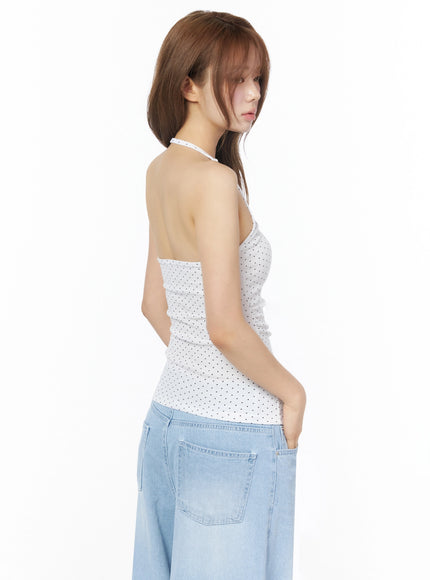 Polka Dot Halter Top IL502 White rear three-quarter shot on model showing open back and crossover halter strap with wide-leg jeans