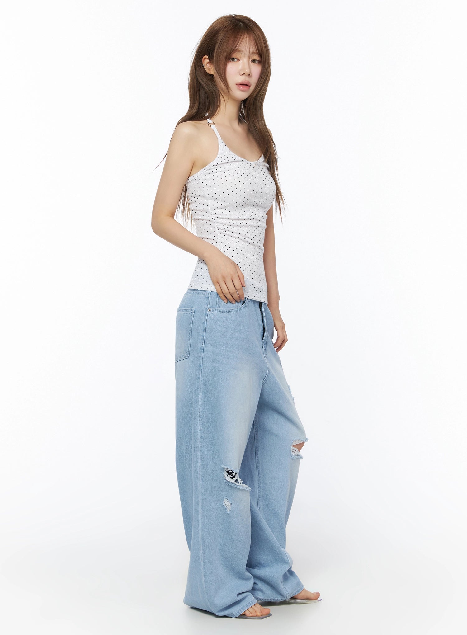 Polka Dot Halter Top IL502 White side shot on model with hand resting at hip showing fitted silhouette and halter strap detail