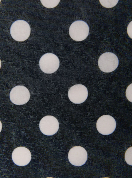 Polka Dot Halter Top IL509 Black close-up fabric detail showing large white polka dots on dark navy-black woven stretch fabric texture
