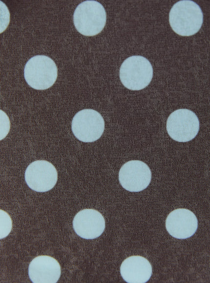 Polka Dot Halter Top IL509 Brown close-up fabric detail showing large light blue polka dots on brown woven stretch fabric texture