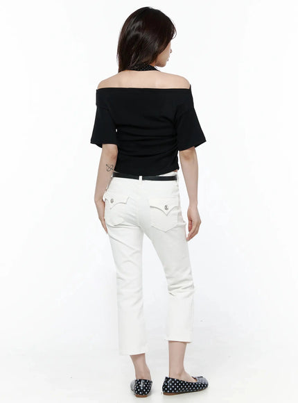 Polka Dot Layered Halter Neck T-Shirt IL506 Black back model shot showing draped off-shoulder back polka dot halter strap and fitted crop hem with white jeans