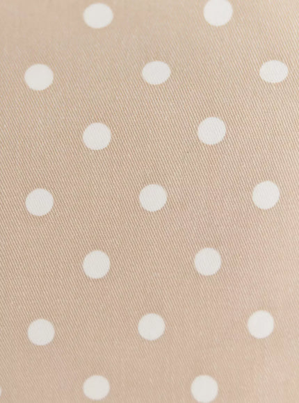 Polka Dot Mini Shorts IL506 Beige close-up fabric detail showing white polka dots on beige twill weave texture