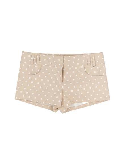 Polka Dot Mini Shorts IL506 Beige flat-lay front view showing white polka dot print, front pockets, belt loops, and D-ring hardware detail on waistband
