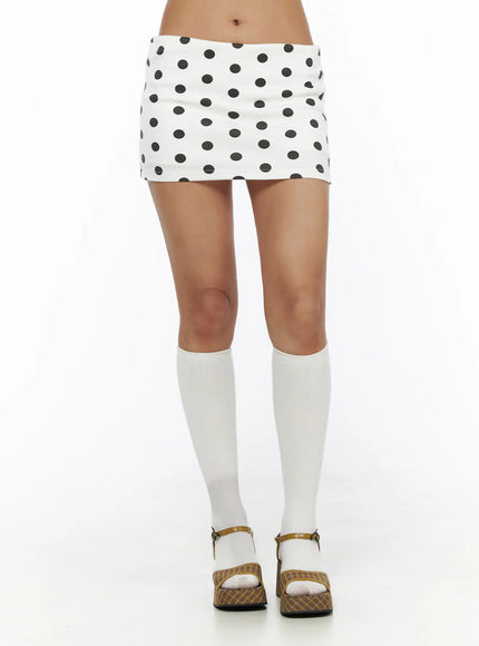 LEWKIN Polka Dot Mini Skirt CL503 Dot white S/M front shot on model standing wearing white knee-high socks and plaid platform sandals