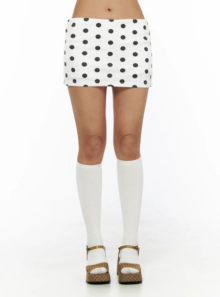 Polka Dot Mini Skirt CL503 Dot white front shot on model standing showing full skirt with white knee socks and buckle platform sandals