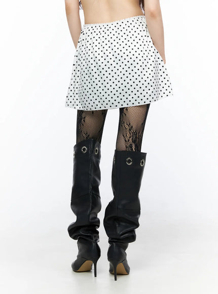 Polka Dot Ribbon Satin Mini Skirt CL522 White back shot on model showing elastic waistband and full polka dot print mini length styled with fishnet tights and boots