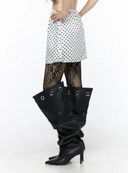 Polka Dot Ribbon Satin Mini Skirt CL522 White side shot on model showing A-line silhouette polka dot fabric and skirt hem length styled with lace tights and boots