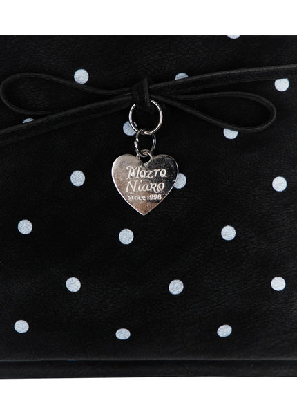 Polka Dot Ribbon Shoulder Bag IL523 Black close-up detail shot silver heart-shaped brand charm engraved Mozto Niaro since 1998 hanging from leather bow on polka dot body