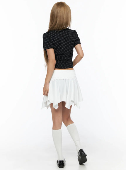 Polka Dot Shirred Puff Sleeve Top CU524 Black back view model standing revealing puff sleeve back and shirred crop hem with white socks