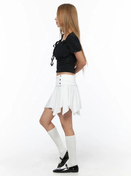 Polka Dot Shirred Puff Sleeve Top CU524 Black side view model standing showing tie ribbon detail and puff sleeve silhouette with white socks