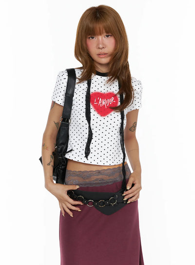 LEWKIN Polka Dot Slim Top CL503 White front view on model wearing black polka dot cropped tee with red L'Amour heart graphic, lace trim, black bag