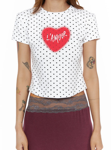Polka Dot Slim Top CL503 White close-up front torso shot on model showing red L'Amour heart spray-paint graphic on white polka dot stretch cropped tee
