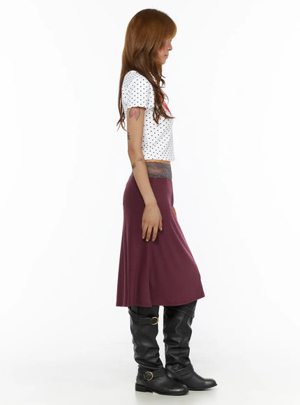 Polka Dot Slim Top CL503 White full-body side view on model showing cropped silhouette, short sleeves, polka dot fabric, with burgundy flared skirt